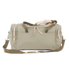 Load image into Gallery viewer, Small Square Duffel - Tan Coated Canvas Front Angle in Color 'Tan Coated Canvas'