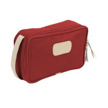 Load image into Gallery viewer, Small Travel Kit - Red Coated Canvas Front Angle in Color 'Red Coated Canvas'