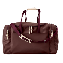Load image into Gallery viewer, Large Square Duffel - Burgundy Coated Canvas Front Angle in Color 'Burgundy Coated Canvas'