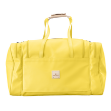 Load image into Gallery viewer, Large Square Duffel - Lemon Coated Canvas Front Angle in Color 'Lemon Coated Canvas'