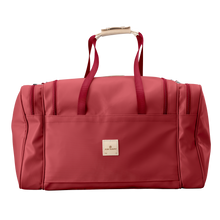 Load image into Gallery viewer, Large Square Duffel - Red Coated Canvas Front Angle in Color 'Red Coated Canvas'