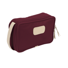 Load image into Gallery viewer, Small Travel Kit - Burgundy Coated Canvas Front Angle in Color 'Burgundy Coated Canvas'
