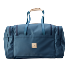 Load image into Gallery viewer, Large Square Duffel - French Blue Coated Canvas Front Angle in Color 'French Blue Coated Canvas'