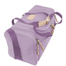Load image into Gallery viewer, Small Square Duffel - Lilac Coated Canvas Front Angle in Color 'Lilac Coated Canvas'