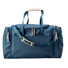 Load image into Gallery viewer, Large Square Duffel - French Blue Coated Canvas Front Angle in Color 'French Blue Coated Canvas'