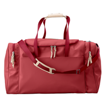 Load image into Gallery viewer, Large Square Duffel - Red Coated Canvas Front Angle in Color 'Red Coated Canvas'