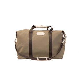 Weekender - Saddle Coated Canvas Front Angle in Color 'Saddle Coated Canvas'