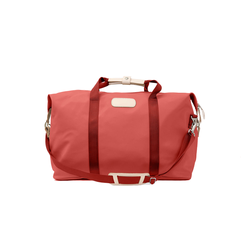 Weekender - Coral Coated Canvas Front Angle in Color 'Coral Coated Canvas'