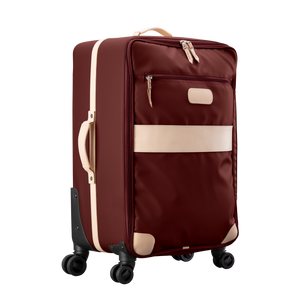 Large 360 wheeled luggage diagonal view in Color 'Burgundy Coated Canvas'