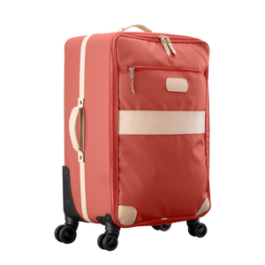 Large 360 wheeled luggage diagonal view in Color 'Coral Coated Canvas'