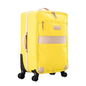 Large 360 wheeled luggage diagonal view in Color 'Lemon Coated Canvas'
