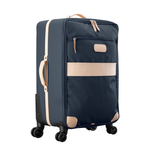 Large 360 wheeled luggage diagonal view in Color 'Navy Coated Canvas'