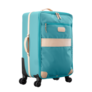 Large 360 wheeled luggage diagonal view in Color 'Ocean Blue Coated Canvas'