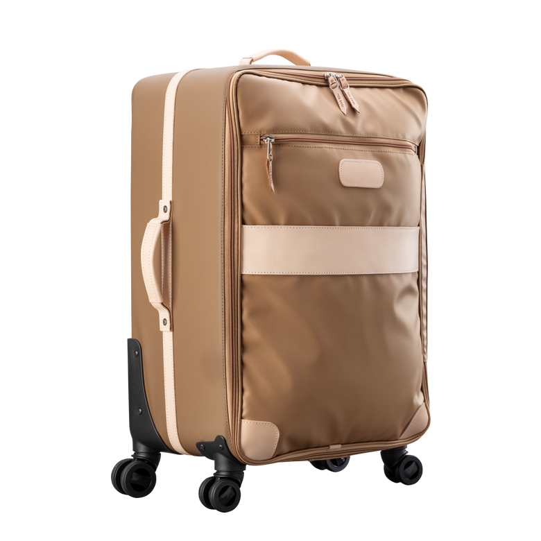 Large 360 wheeled luggage diagonal view in Color 'Saddle Coated Canvas'