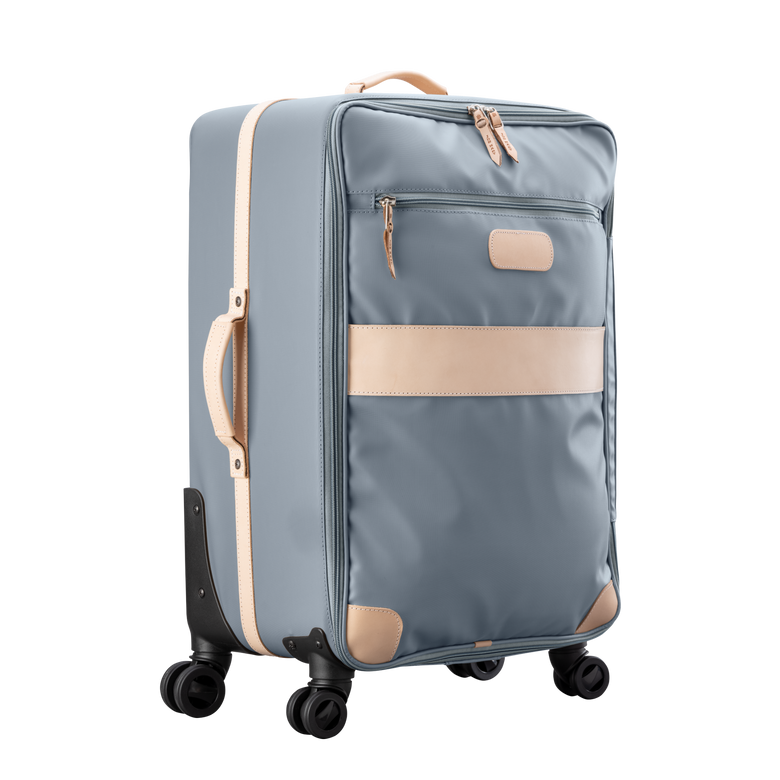Large 360 wheeled luggage diagonal view in Color 'Slate Coated Canvas'