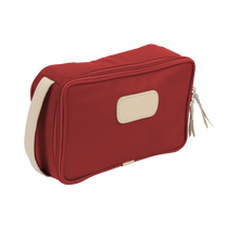 Load image into Gallery viewer, Small Travel Kit - Red Coated Canvas Front Angle in Color &#39;Red Coated Canvas&#39;
