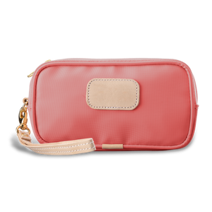 Wristlet - Coral Coated Canvas Front Angle in Color 'Coral Coated Canvas'
