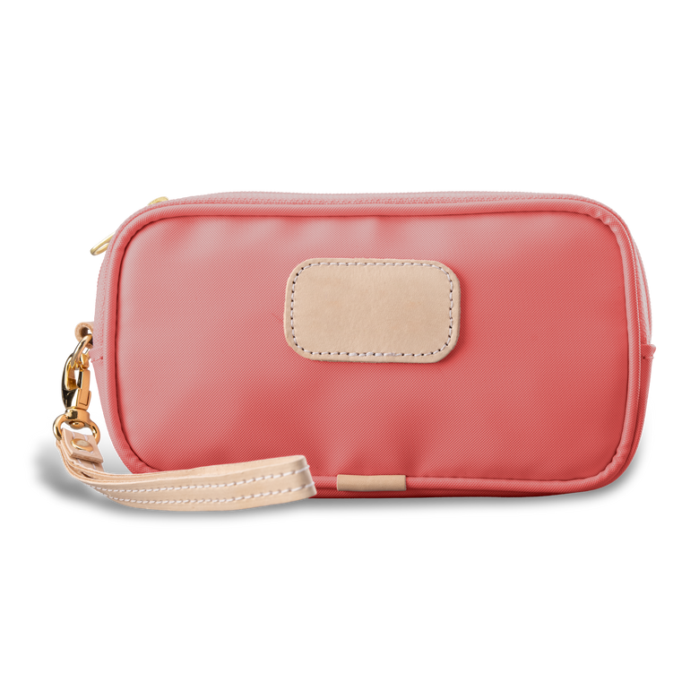 Wristlet - Coral Coated Canvas Front Angle in Color 'Coral Coated Canvas'