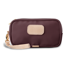 Load image into Gallery viewer, Wristlet - Burgundy Coated Canvas Front Angle in Color &#39;Burgundy Coated Canvas&#39;

