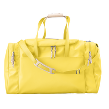 Load image into Gallery viewer, Large Square Duffel - Lemon Coated Canvas Front Angle in Color &#39;Lemon Coated Canvas&#39;

