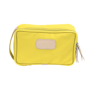 Small Travel Kit - Lemon Coated Canvas Front Angle in Color 'Lemon Coated Canvas'