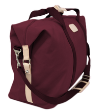 Load image into Gallery viewer, Weekender - Burgundy Coated Canvas Front Angle in Color &#39;Burgundy Coated Canvas&#39;
