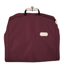 Load image into Gallery viewer, 50&quot; Garment Bag - Burgundy Coated Canvas Front Angle in Color &#39;Burgundy Coated Canvas&#39;
