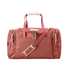 Load image into Gallery viewer, Medium Square Duffel - Coral Coated Canvas Front Angle in Color &#39;Coral Coated Canvas&#39;
